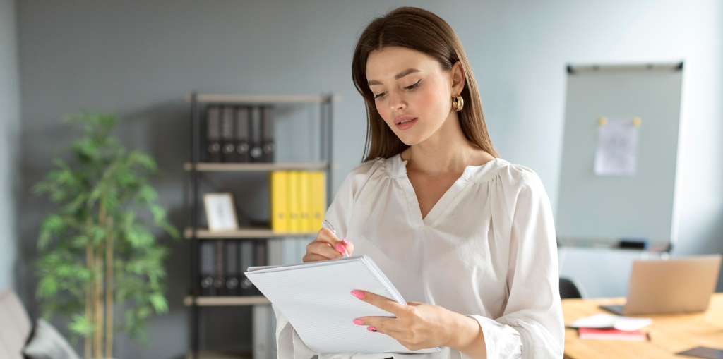woman-taking-notes-her-notebook-work 1.png