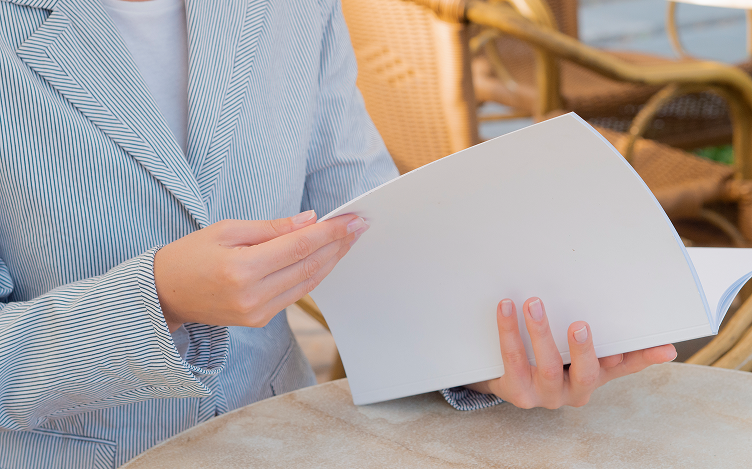 close-up-woman-reading-mock-up-magazine 1.png